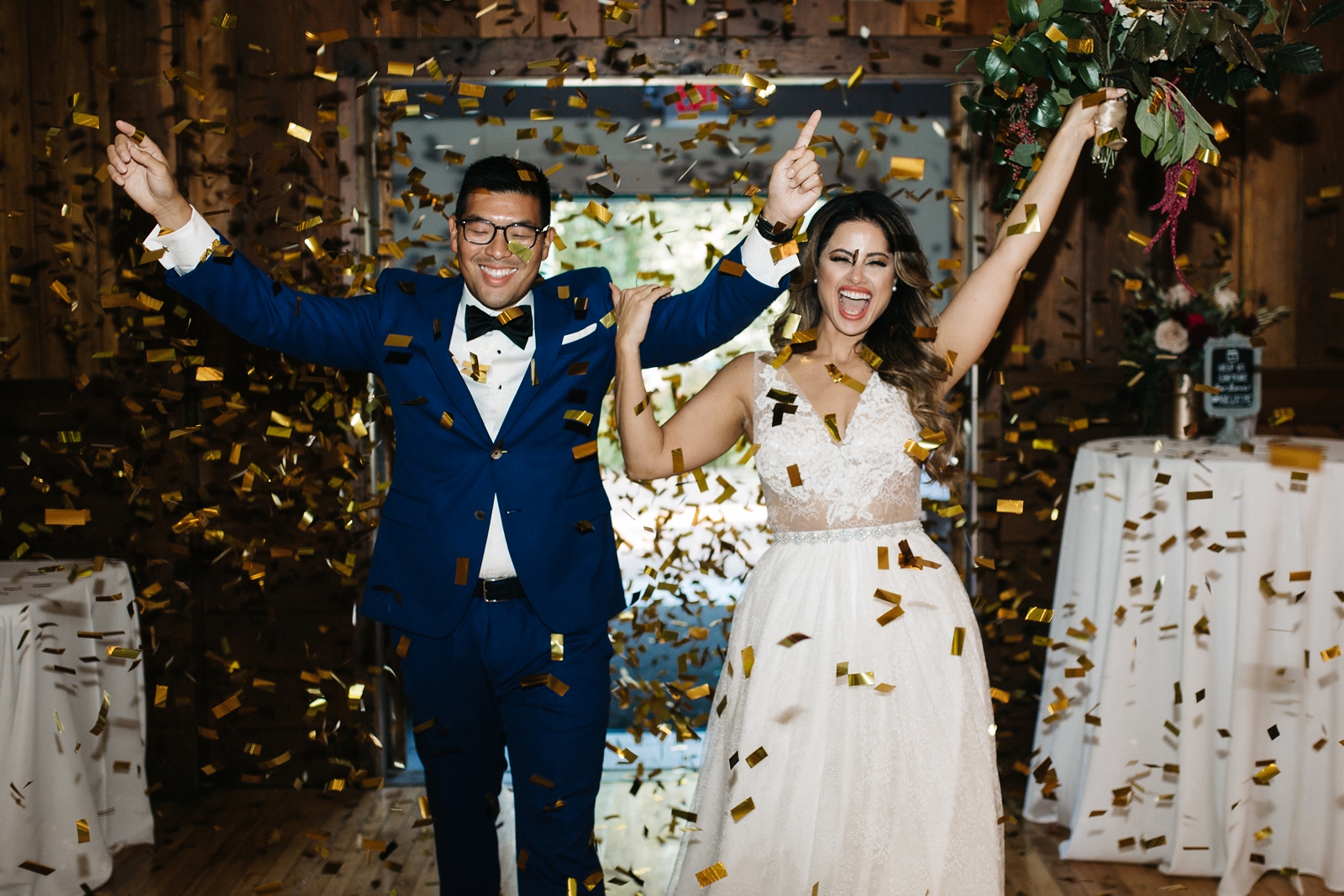married couple walking through confetti