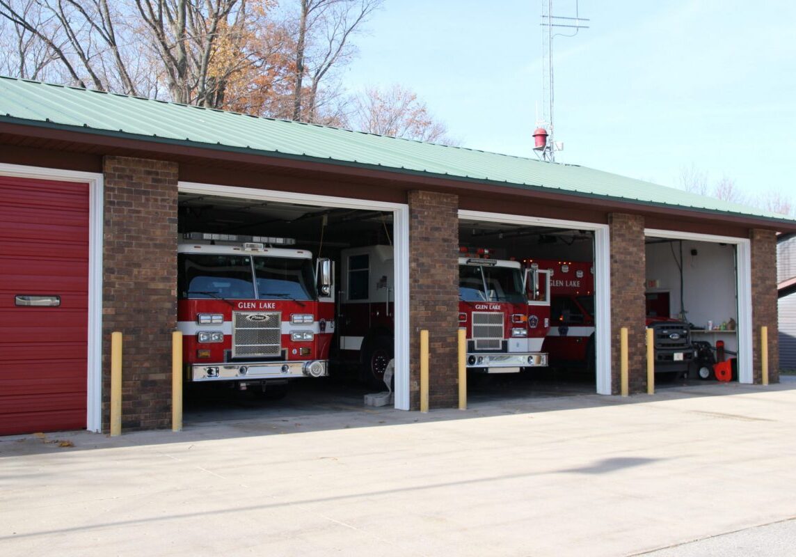 emergency services, garage doors open, vehicles ready for a call