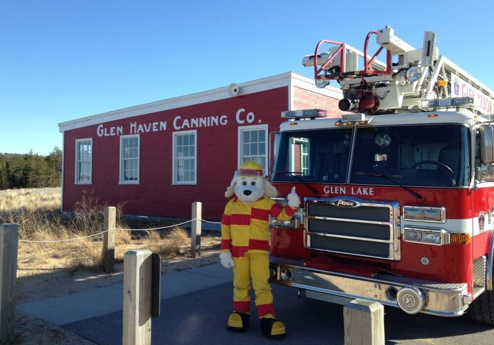 dog fire dept mascot in front of cannery at glen haven